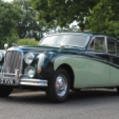 Stunning in two-tone green, this 1959 Jaguar MkIX is a matching-numbers example showing a genuine 66,000 miles. It’s estimated at £18,000-£20,000.