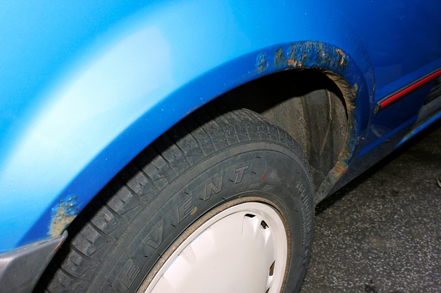 The dreaded bubbling paintwork suggests this steel rear wing is infested with iron oxide.