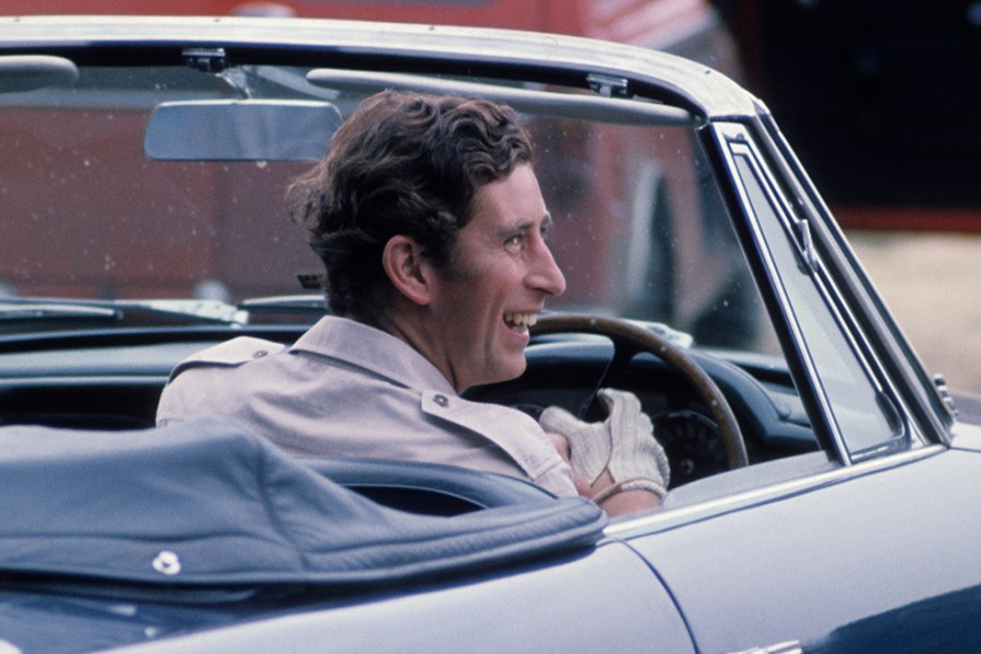 King Charles III, then-Prince of Wales, arrives in his Aston Martin to attend polo at Windsor Great Park on June 1,1975 (Photo by Anwar Hussein/Getty Images)