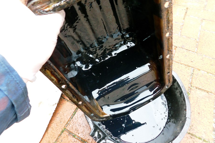 In the event of severe contamination, consider that physical removal and cleaning may be the only option. This engine sump pan contained several centimetres of  congealed sludge.