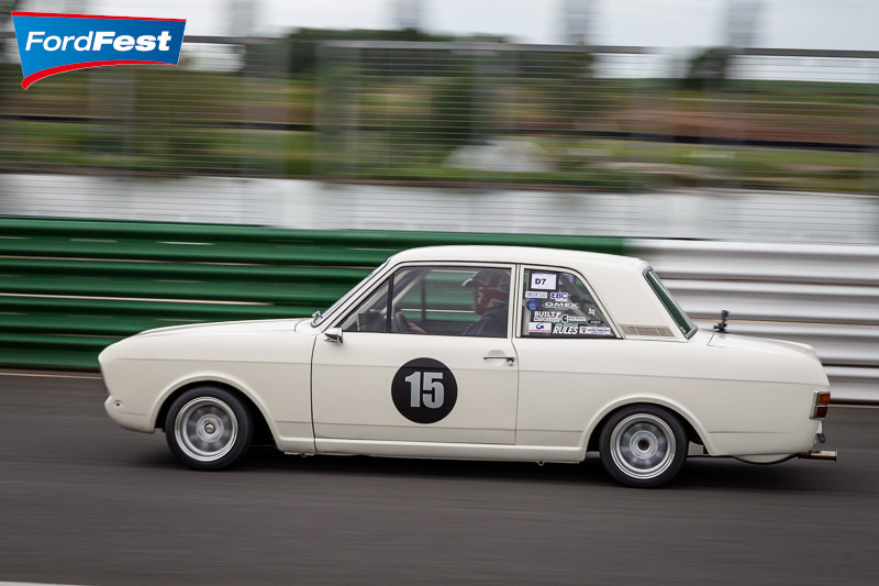 Ford Cortina driving on a racetrack