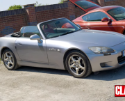 Honda S2000 parked in a car park with the roof down