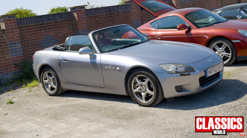 Honda S2000 parked in a car park with the roof down