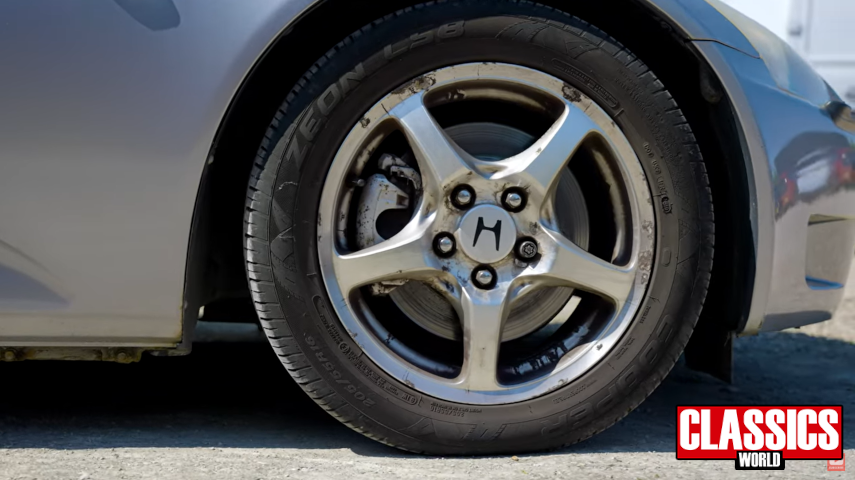 close up shot of dirty old Honda S2000 alloy wheel