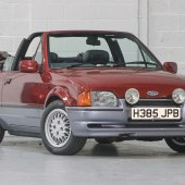 One of several Fords in the sale is this smart 1990 Escort XR3i Cabriolet finished in the attractive combination of Flambeau Red over Moonstone Blue. Also boasting half-leather trim and cross-spoke alloys, it comes with a long MoT and is guided at a tantalising £5000-£7000