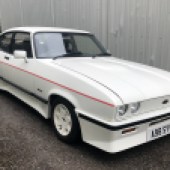 Surely a contender for the Holy Grail of Ford Capris, the body-kitted Tickford Turbo cost more than twice as much as a standard 2.8 Injection when new. This 1983 example is car number four out of just 96 made and has appeared in countless magazines. It's estimated at £35,000-£45,000.
