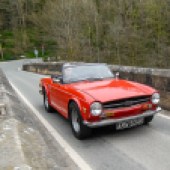 Triumph TR6 on driving road